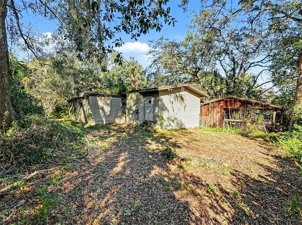 4818 Sadler Road Apopka, FL 32712 - Photo 1 of 21 a view of a house with a yard