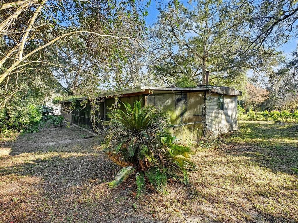 4818 Sadler Road Apopka, FL 32712 - Photo 2 of 21 a backyard of a house with lots of green space