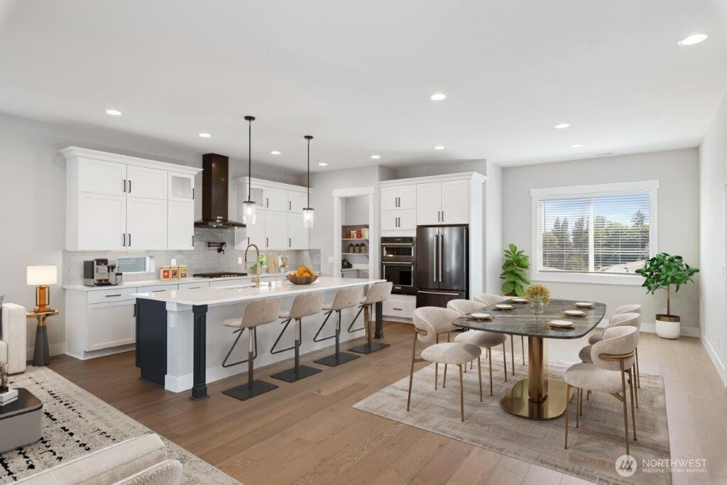 7573 South 130th Place Seattle, WA 98178 - Photo 5 of 10 a large kitchen with lots of counter space and stainless steel appliances