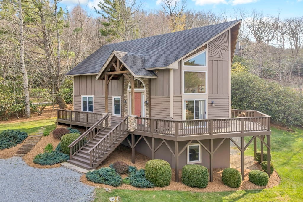 126 Knob Road Blowing Rock, NC 28605 - Photo 1 of 50 a front view of a house with garden