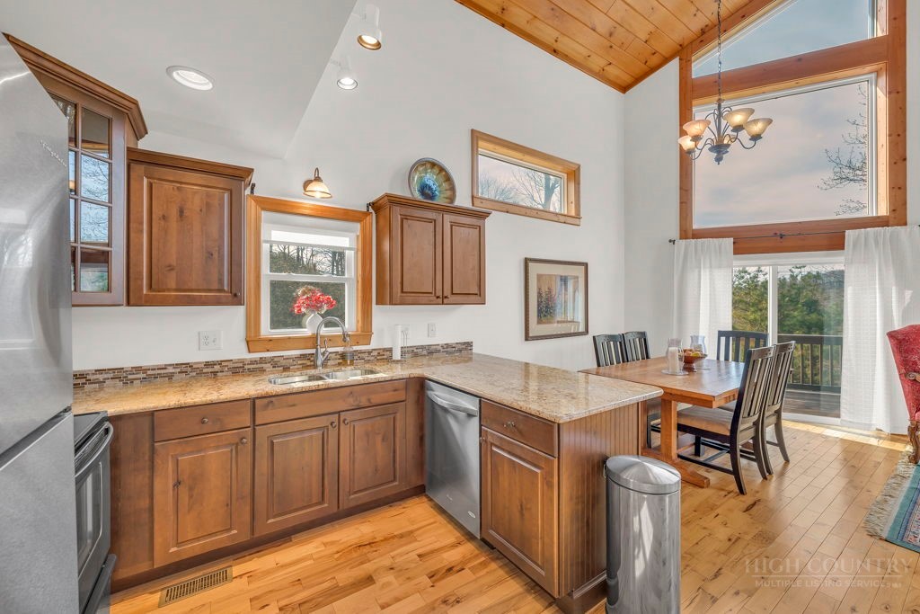 126 Knob Road Blowing Rock, NC 28605 - Photo 13 of 50 a view of a kitchen counter space and sink