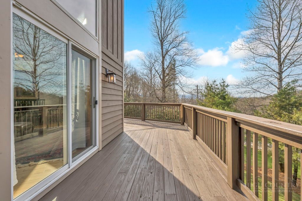 126 Knob Road Blowing Rock, NC 28605 - Photo 18 of 50 a view of balcony with wooden floor and fence