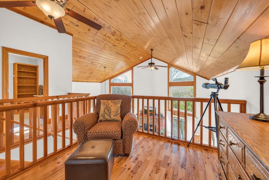 126 Knob Road Blowing Rock, NC 28605 - Photo 30 of 50 a balcony with wooden floor and furniture