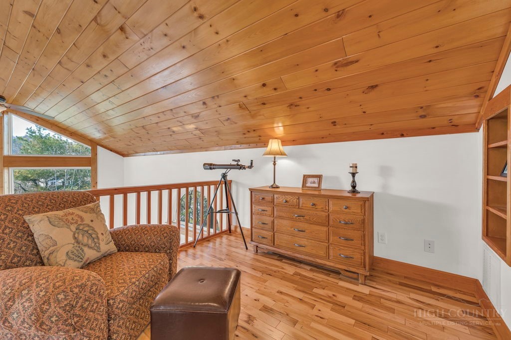 126 Knob Road Blowing Rock, NC 28605 - Photo 33 of 50 a bedroom with furniture and wooden floor