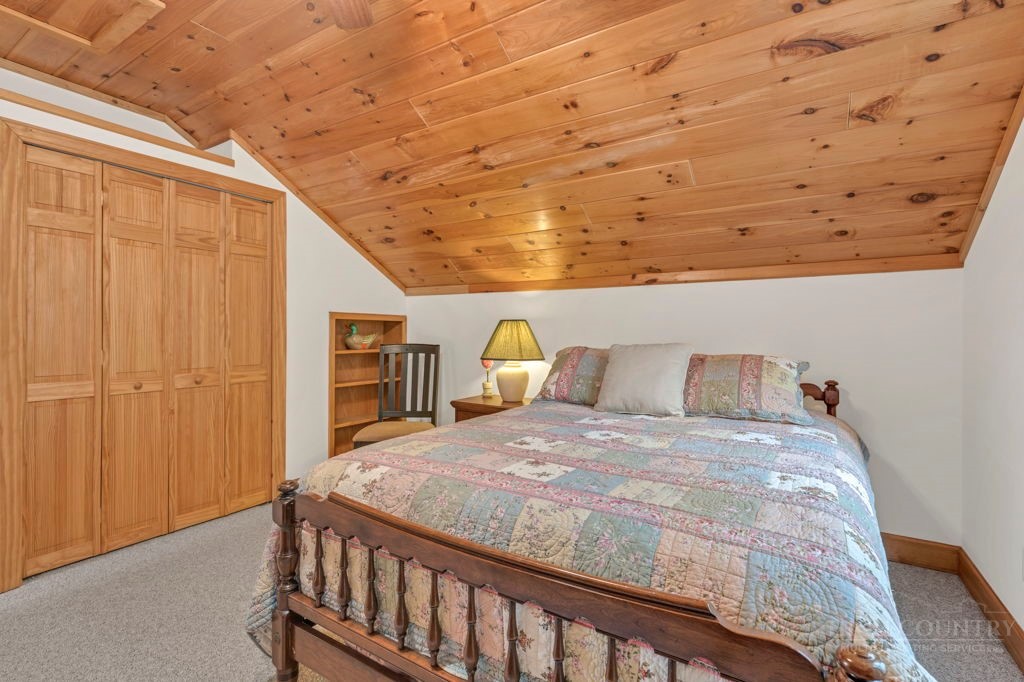 126 Knob Road Blowing Rock, NC 28605 - Photo 35 of 50 a bedroom with a bed and a window