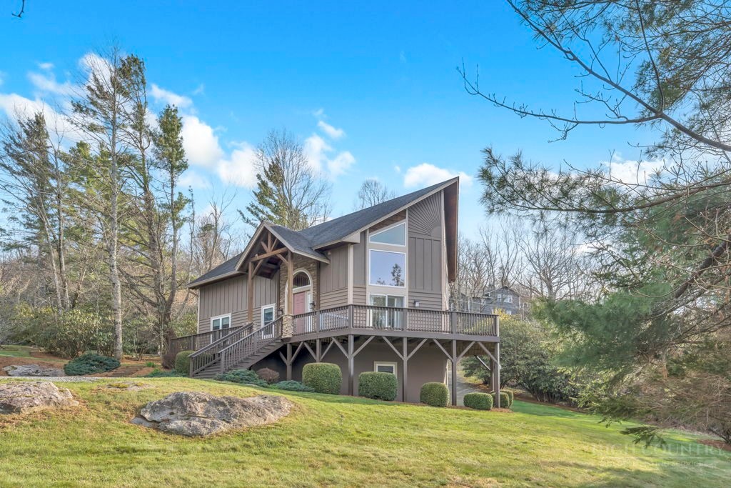 126 Knob Road Blowing Rock, NC 28605 - Photo 4 of 50 a house view with swimming pool and trees in the background