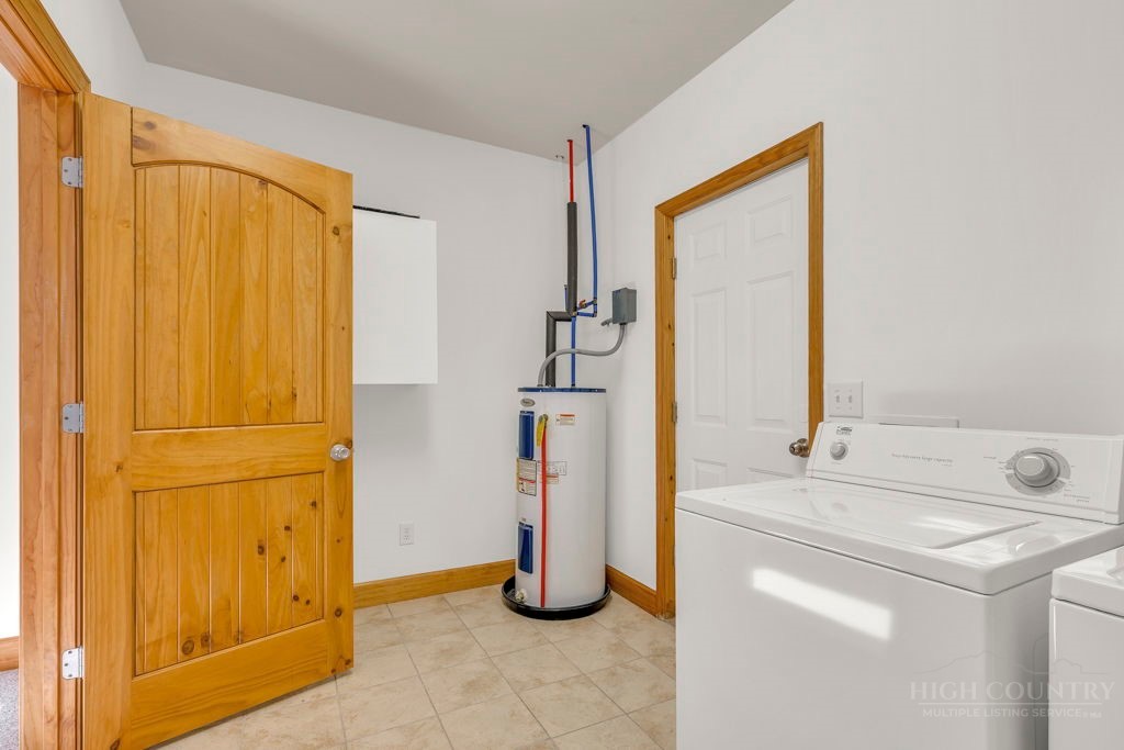 126 Knob Road Blowing Rock, NC 28605 - Photo 44 of 50 a bathroom with a sink and a mirror