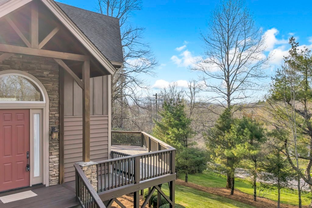 126 Knob Road Blowing Rock, NC 28605 - Photo 6 of 50 a view of a roof deck with wooden fence and floor