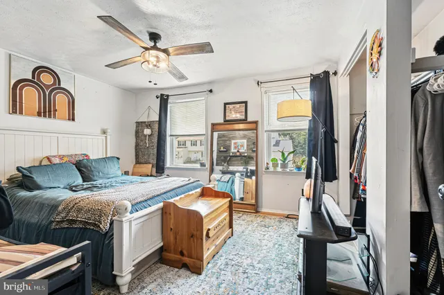 a bed room with a bed and a flat screen tv