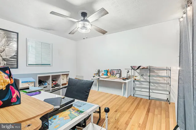 a workspace with furniture and a wooden floor