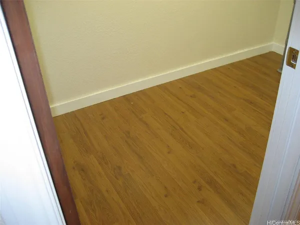 a view of balcony with wooden floor