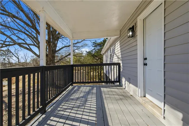 a view of balcony with wooden floor