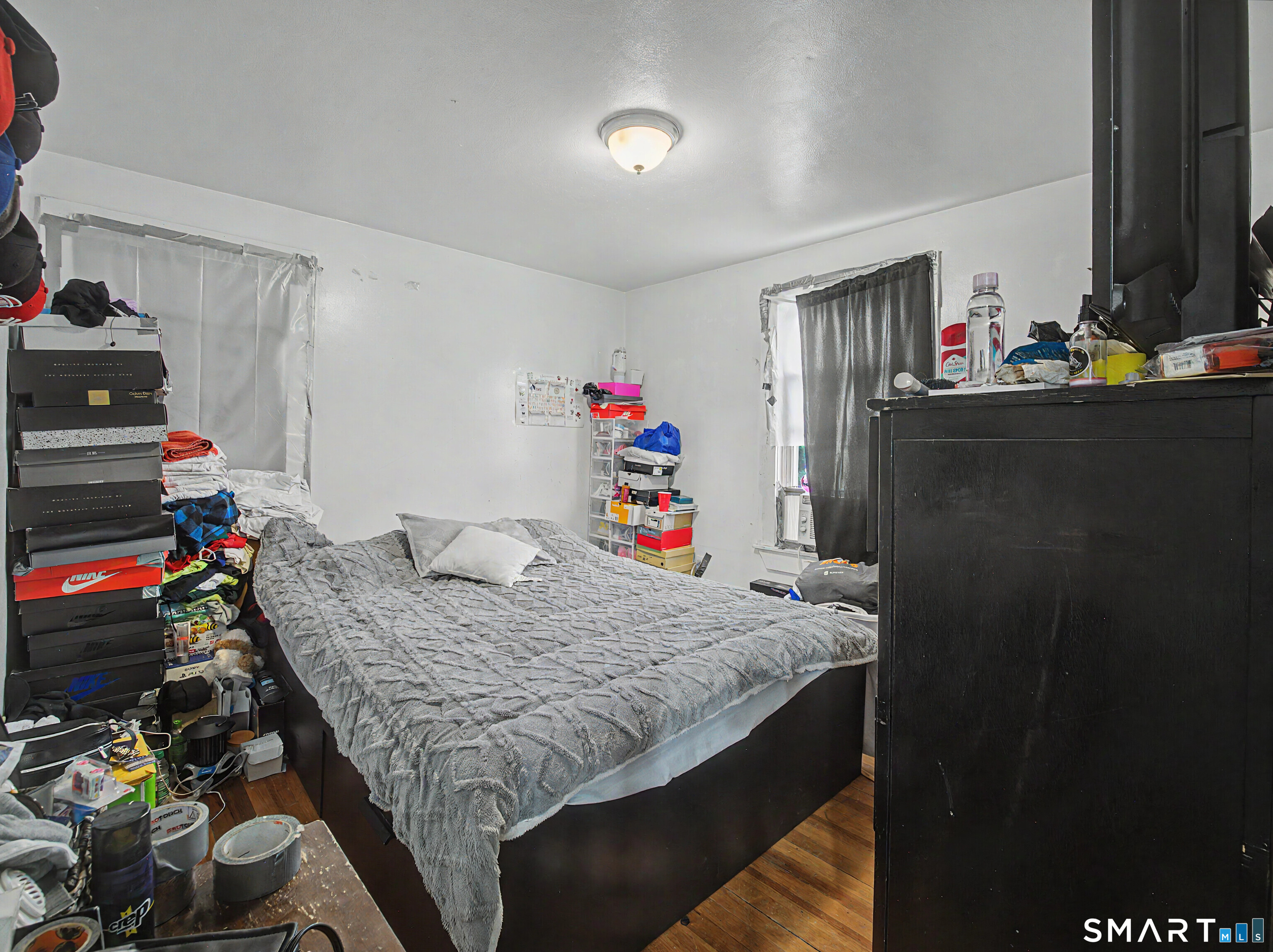 319 Carroll Avenue Bridgeport, CT 06607 - Photo 24 of 40 a bedroom with a bed and cabinets