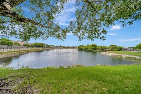 a view of lake with green space
