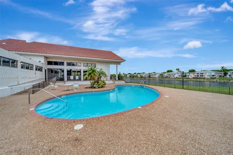 a view of a swimming pool and a chairs