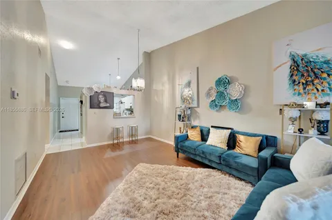 a living room with furniture and a rug