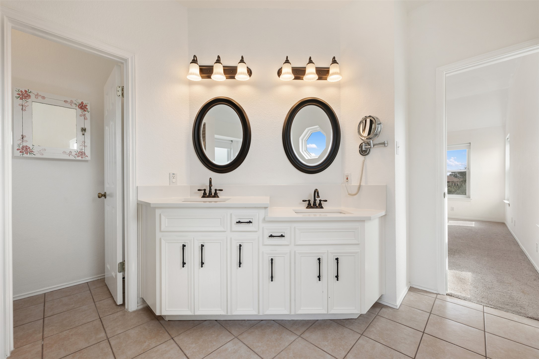 104 Sunset Road Georgetown, TX 78633 - Photo 28 of 40 Bathroom with double vanity, light tile patterned flooring, and light carpet
