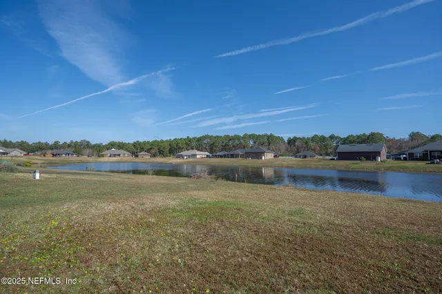 a view of lake with green space