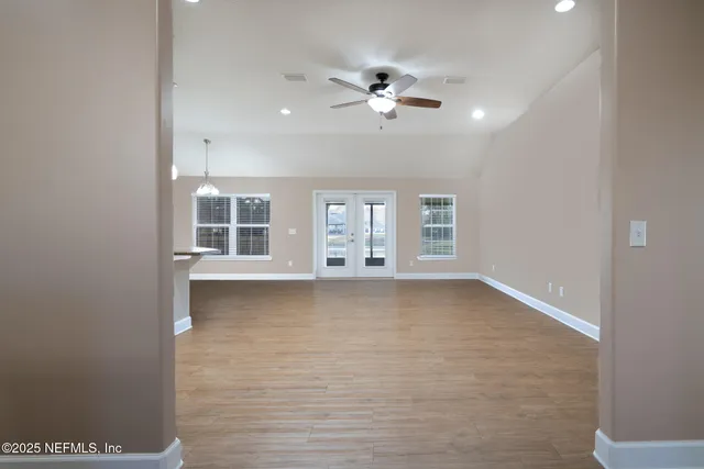 a view of an empty room with a window