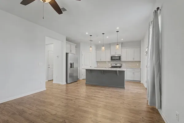 a bathroom with a sink a mirror and vanity