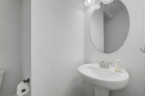 a view of a hallway with a ceiling fan