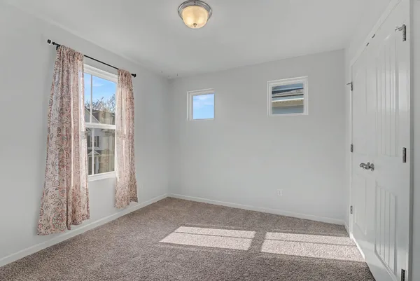 a bathroom with a granite countertop sink mirror and toilet