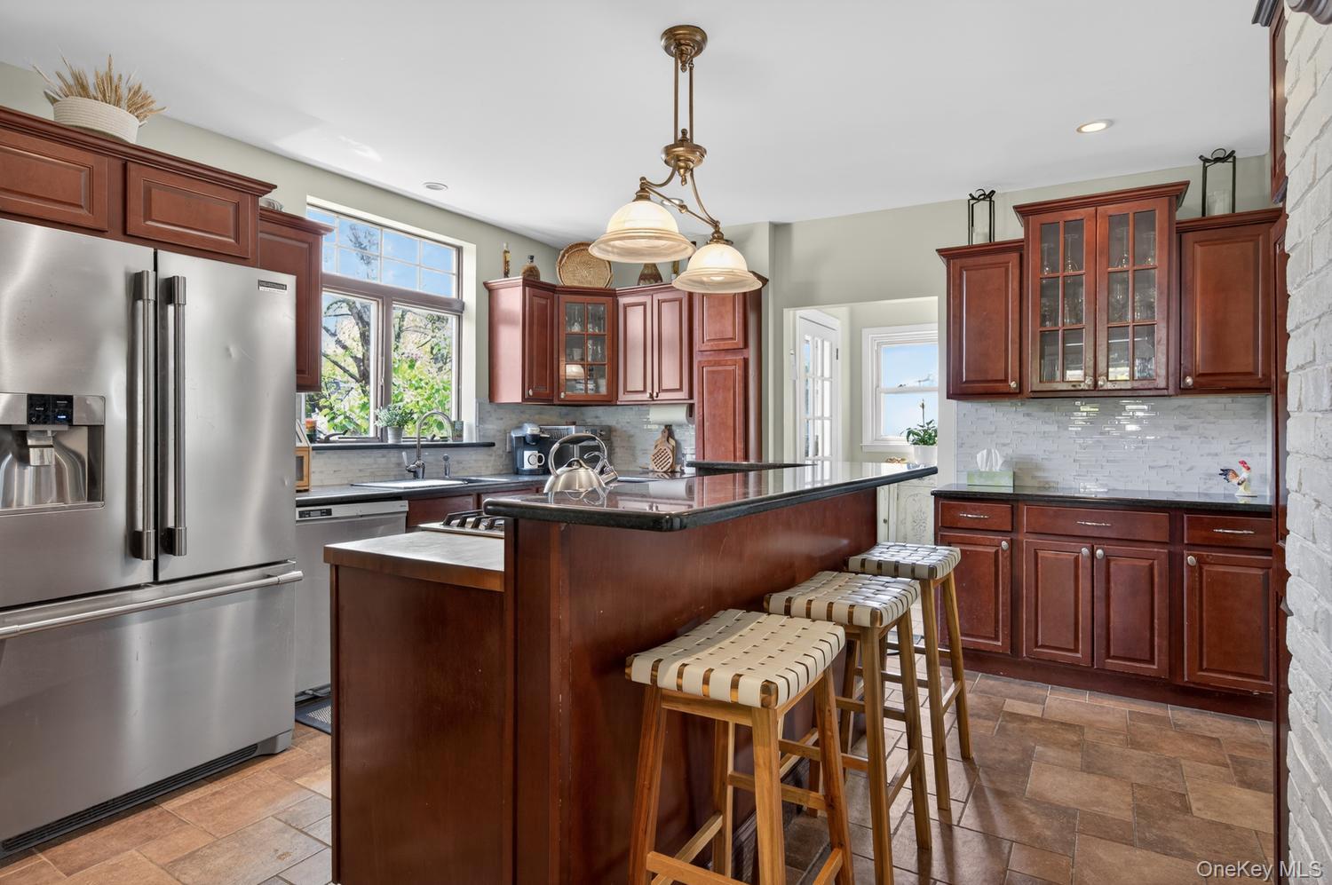 17 Riggs Place Locust Valley, NY 11560 - Photo 13 of 25 Eat In Kitchen with granite countertops and stainless steel appliances