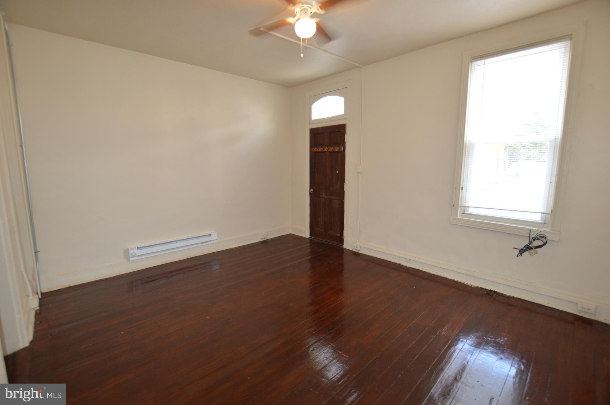 482 West South Street Frederick, MD 21701 - Photo 13 of 14 an empty room with wooden floor and windows