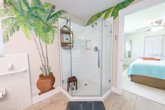 a bedroom with a bed and a couch