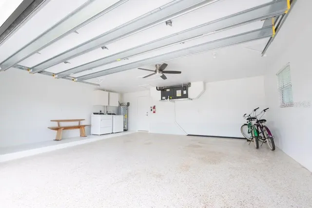 a view of a garage with table and chairs