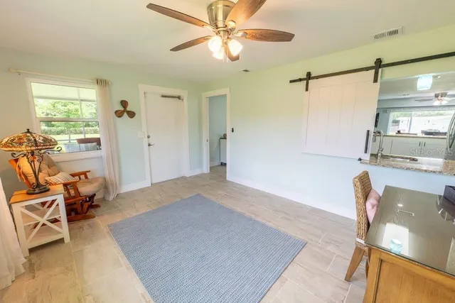 a living room with furniture and a window