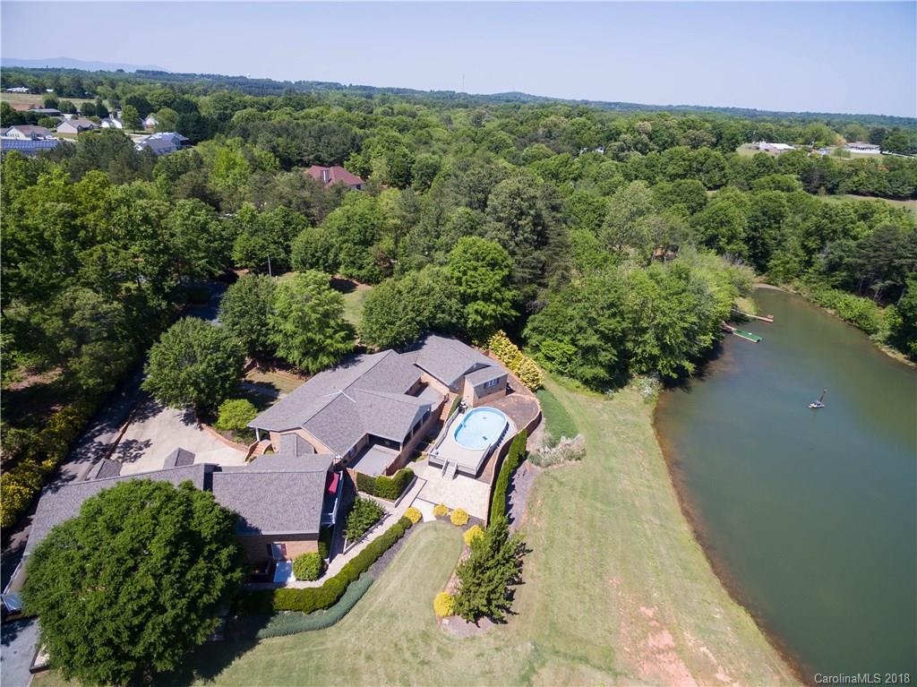 1491 Ballenger Road Inman, SC 29349 - Photo 2 of 35 an aerial view of a house with a garden and lake view
