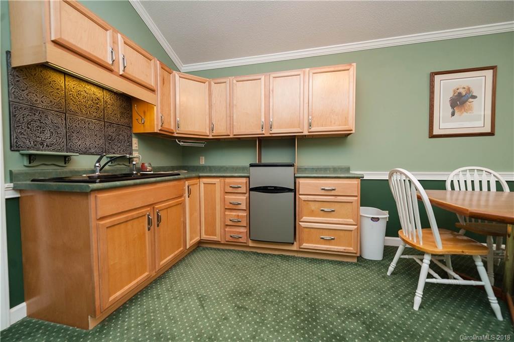 1491 Ballenger Road Inman, SC 29349 - Photo 23 of 35 a kitchen with cabinets and chair