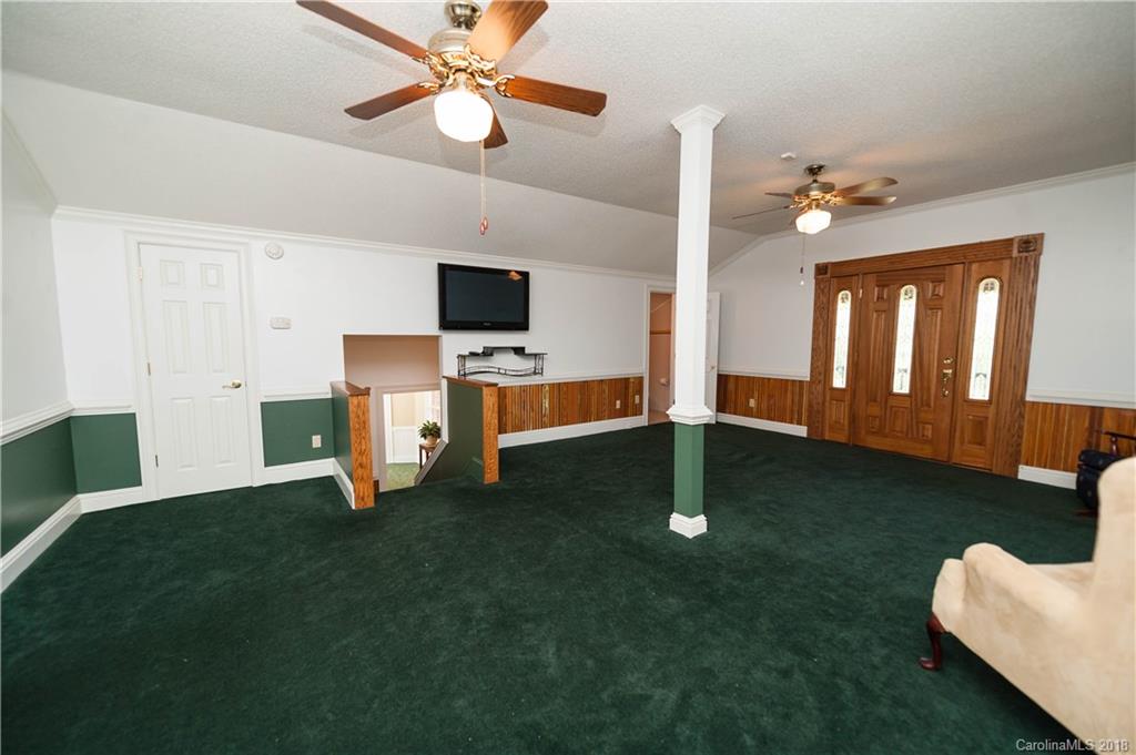1491 Ballenger Road Inman, SC 29349 - Photo 27 of 35 a living room with furniture and a flat screen tv