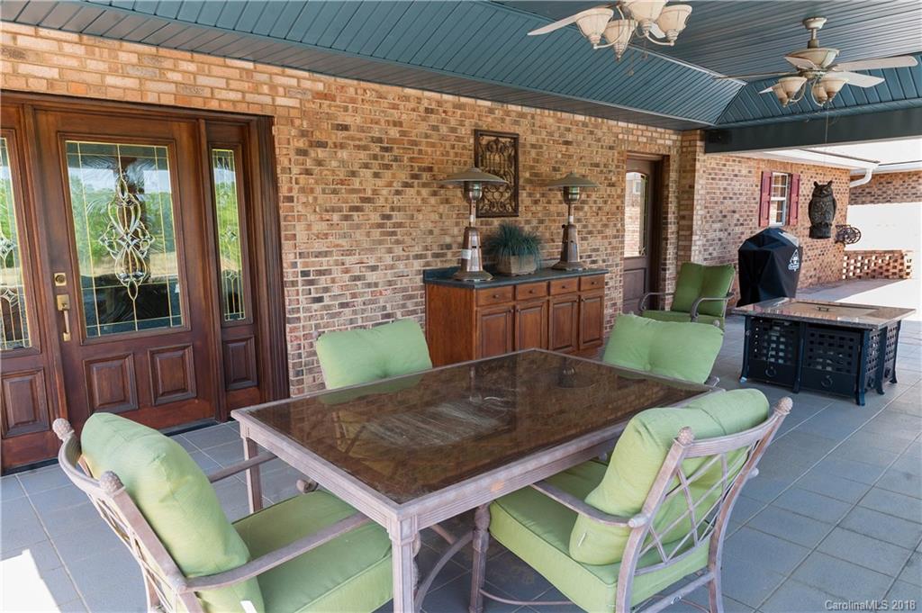 1491 Ballenger Road Inman, SC 29349 - Photo 33 of 35 a view of a dining room with furniture wooden floor and chandelier