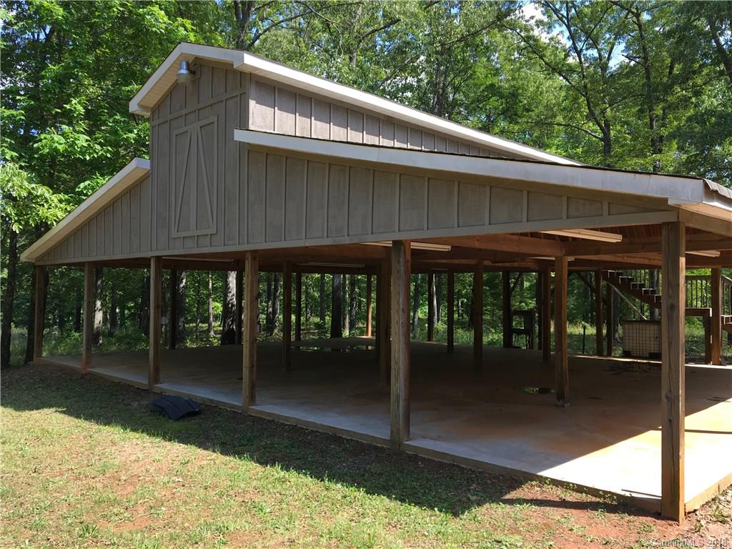 1491 Ballenger Road Inman, SC 29349 - Photo 35 of 35 a backyard of a house with barbeque oven table and chairs