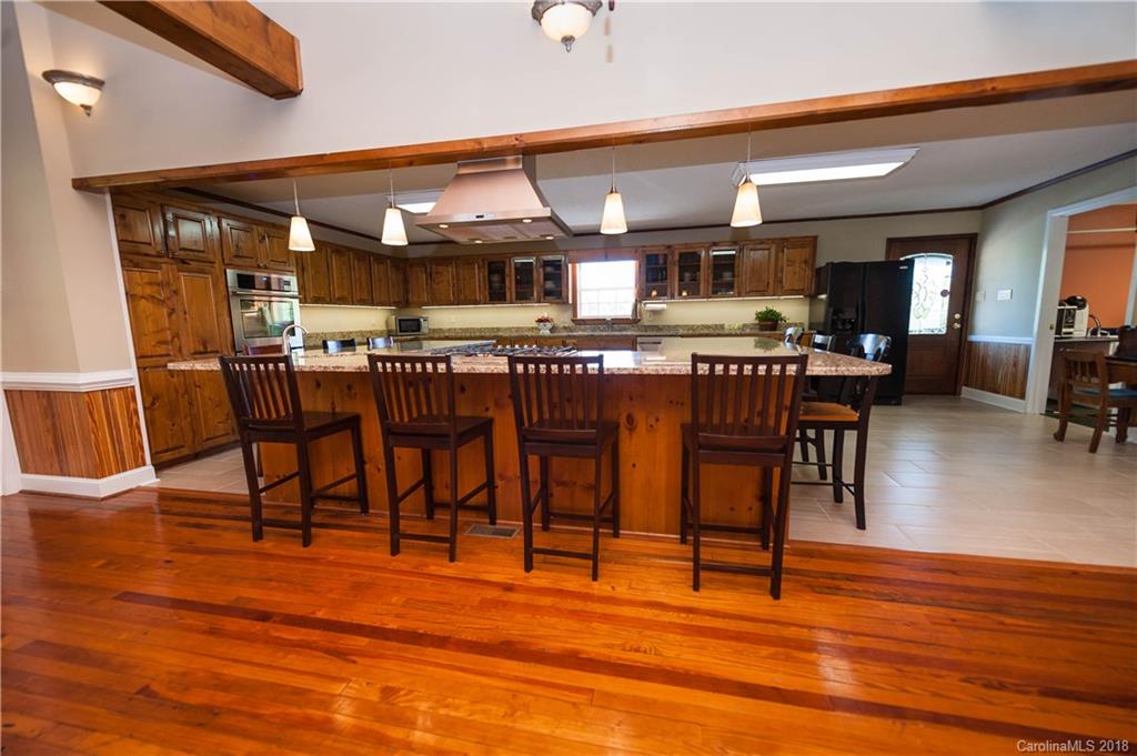 1491 Ballenger Road Inman, SC 29349 - Photo 7 of 35 a view of a dining room with furniture and wooden floor
