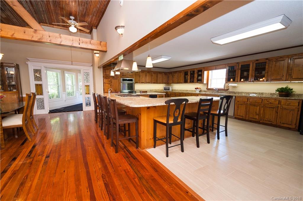 1491 Ballenger Road Inman, SC 29349 - Photo 8 of 35 a view of a dining room with furniture and wooden floor