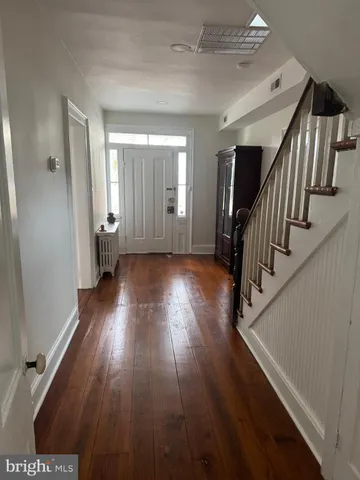 a view of entryway with wooden floor