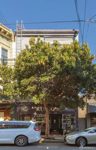 a view of a car parked in front of a building