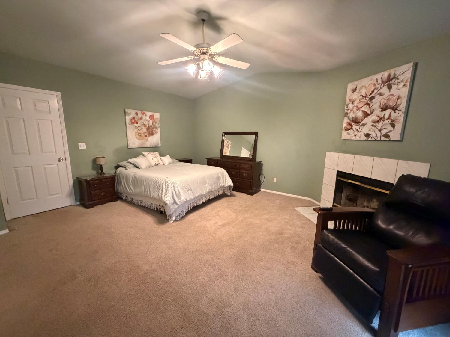 16638 Mark Road Madera, CA 93636 - Photo 17 of 22 a bedroom with a bed and a chandelier