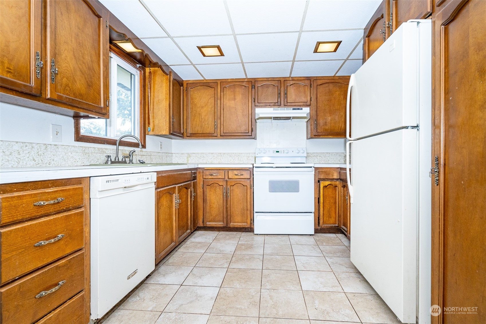 738 Southwest 19th Street Chehalis, WA 98532 - Photo 11 of 40 a kitchen with a sink a stove top oven and cabinets