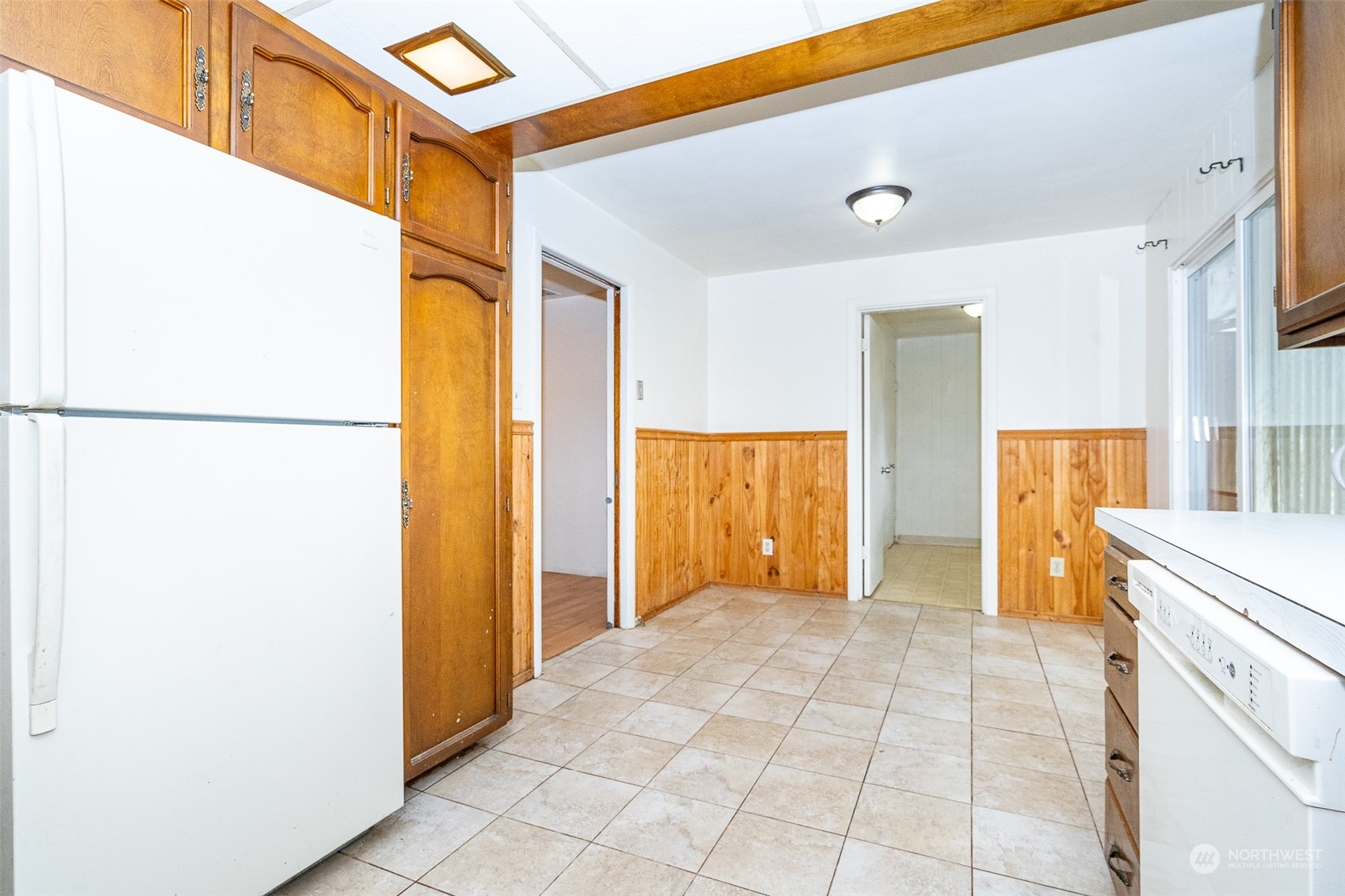 738 Southwest 19th Street Chehalis, WA 98532 - Photo 12 of 40 a view of a refrigerator in kitchen and an empty room