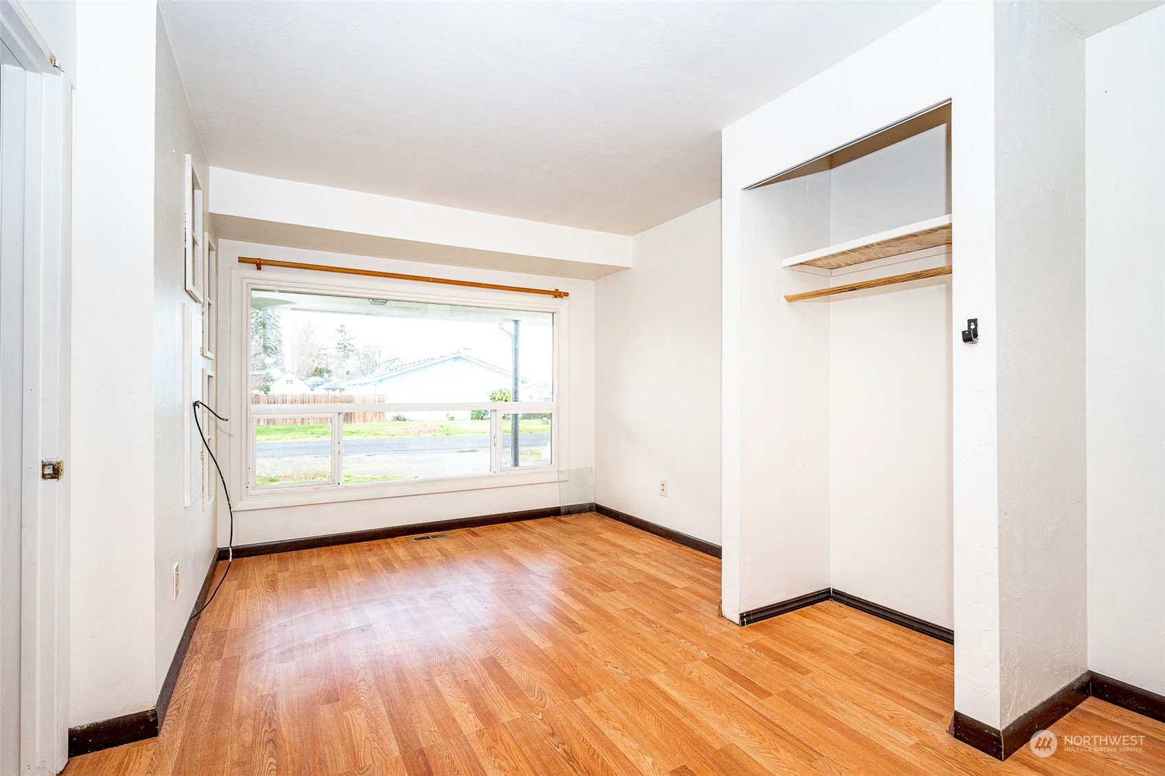 738 Southwest 19th Street Chehalis, WA 98532 - Photo 19 of 40 an empty room with wooden floor and windows