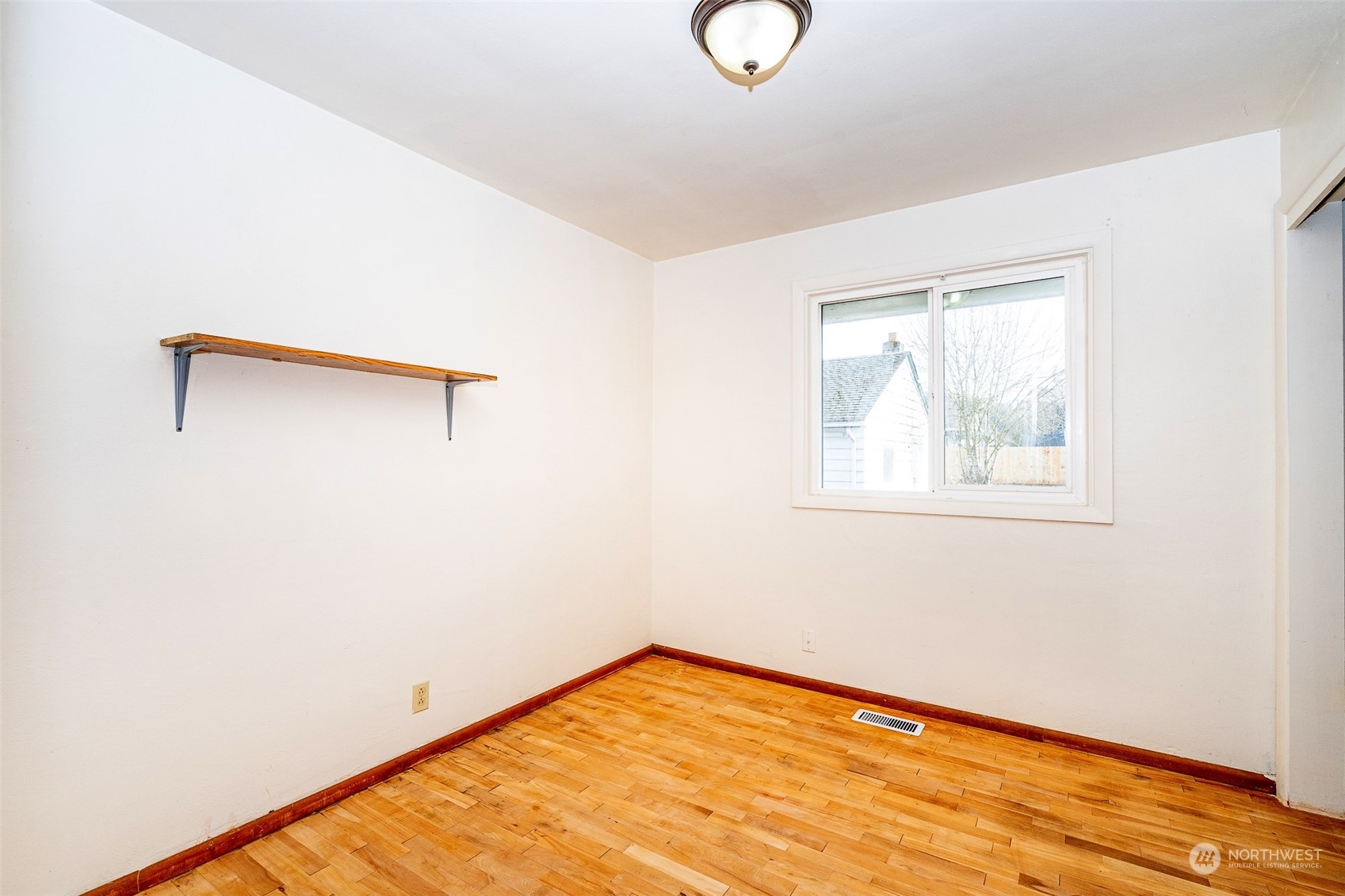 738 Southwest 19th Street Chehalis, WA 98532 - Photo 23 of 40 a view of a room with wooden floor and white walls