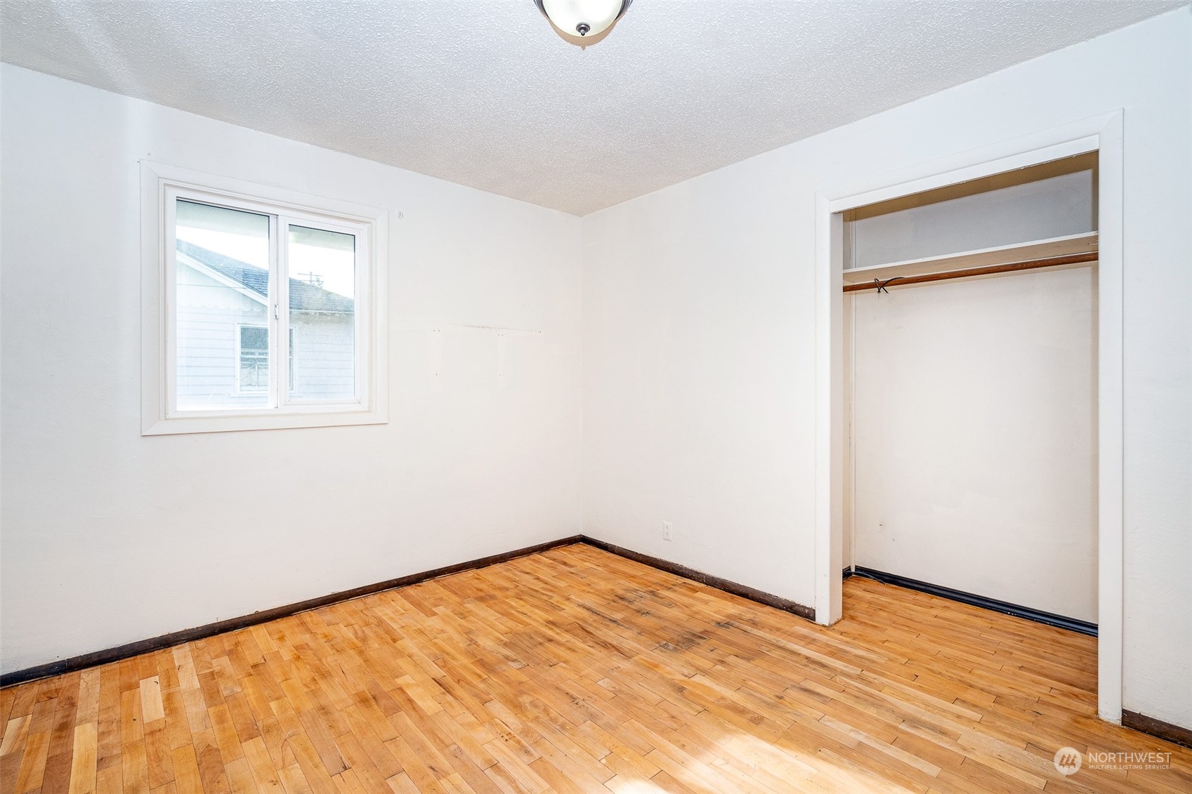 738 Southwest 19th Street Chehalis, WA 98532 - Photo 30 of 40 a view of empty room with wooden floor