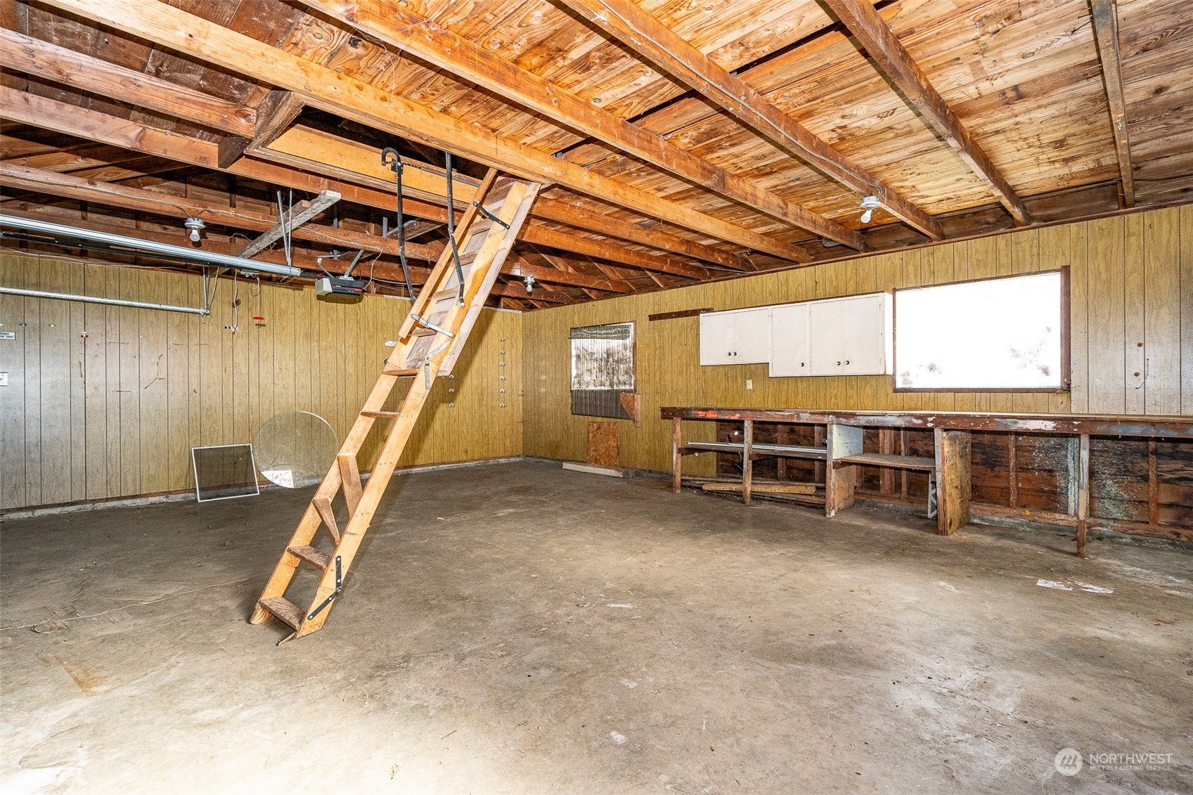 738 Southwest 19th Street Chehalis, WA 98532 - Photo 35 of 40 a view of a big room with wooden walls and stairs