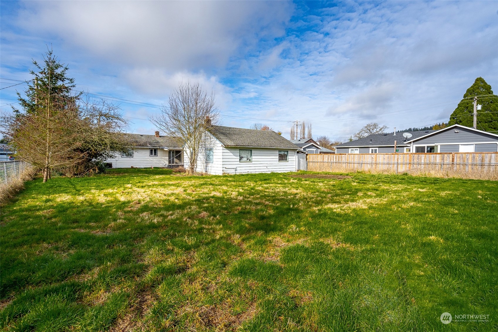 738 Southwest 19th Street Chehalis, WA 98532 - Photo 5 of 40 a swimming pool with trees in the background