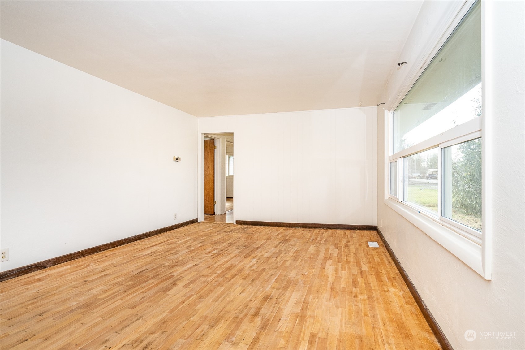 738 Southwest 19th Street Chehalis, WA 98532 - Photo 9 of 40 a view of an empty room and window