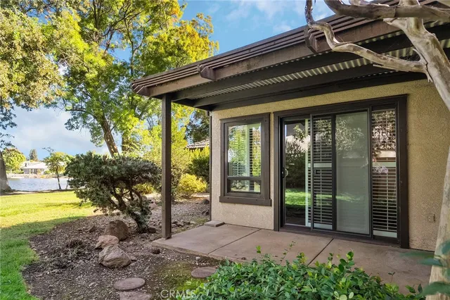 a view of a house with backyard and porch